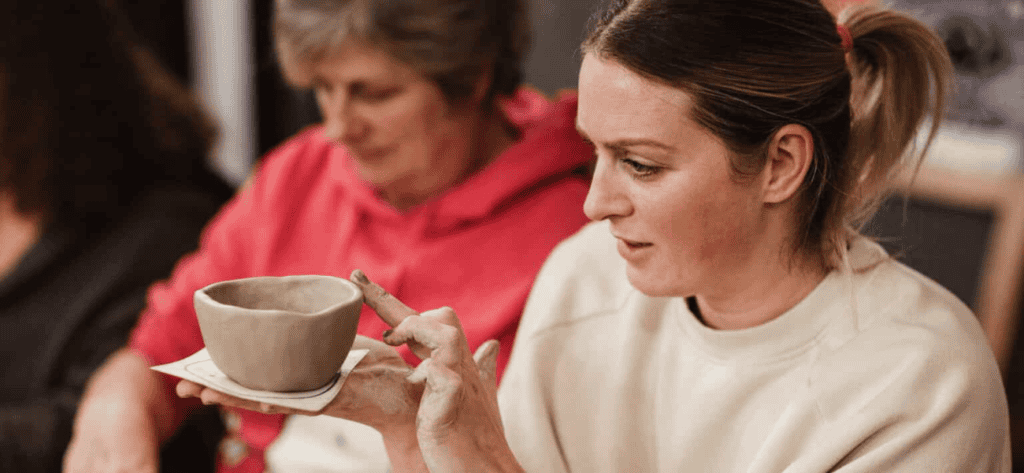 lady at a pottery hen do workshop