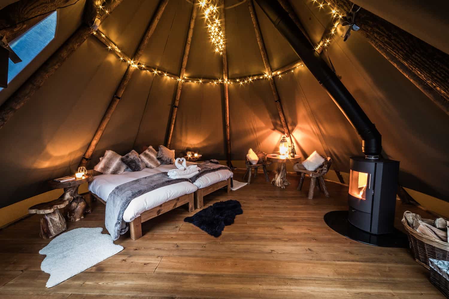 beautiful bedroom in tipi at glamping hen party site in the Peak District